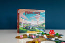 Farms Race Board Game Box with Tiles, Dice, and Wooden Pieces Laid Out In Front