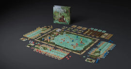 A fully set up game board for Feya's Swamp, with the box in the background.