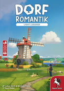 Board game box for 'Dorf Romantik Light Luggage' with a windmill and scenic landscape.