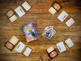 Skull King Gameplay with Cards Dealt Out to 4 Players on Wooden Tabletop Background