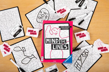Mind the lines pieces and box laid out on a wooden table