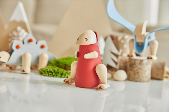 DIY Tyrannosaurus by Plan Toys. This creative kit features wooden pieces and vibrant colors, encouraging imaginative play and hands-on building for children.