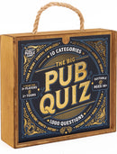 The Big Pub Quiz game by Professor Puzzle featuring a decorative wooden box with a rope handle. The box displays 'The Big Pub Quiz' in bold letters, surrounded by vibrant graphics indicating categories, such as 'Food & Drink', 'General Knowledge', 'Science & Nature', 'Sports', 'History', 'Art & Literature', and 'Music, TV & Film'. It notes the game is suitable for 3 or more players and offers 1000 questions across 10 categories, aimed at ages 14 and up.