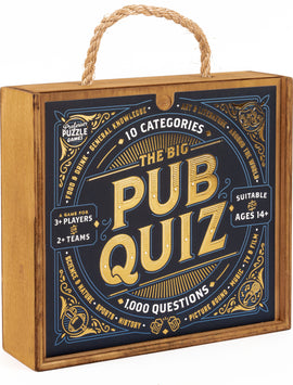 The Big Pub Quiz game by Professor Puzzle featuring a decorative wooden box with a rope handle. The box displays 'The Big Pub Quiz' in bold letters, surrounded by vibrant graphics indicating categories, such as 'Food & Drink', 'General Knowledge', 'Science & Nature', 'Sports', 'History', 'Art & Literature', and 'Music, TV & Film'. It notes the game is suitable for 3 or more players and offers 1000 questions across 10 categories, aimed at ages 14 and up.