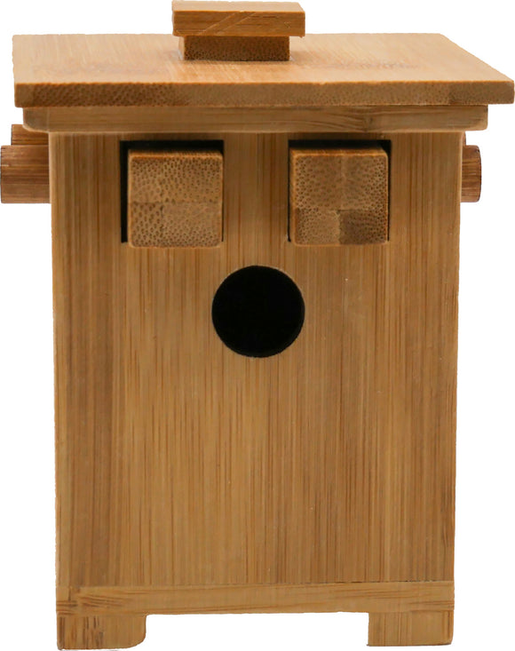 The Honey Hive Secret Box by Project Genius is a beautifully crafted mechanical puzzle made from bamboo. It features a unique design with a sliding top and two wooden blocks for unlocking the secret compartment, combining elegance with challenge.