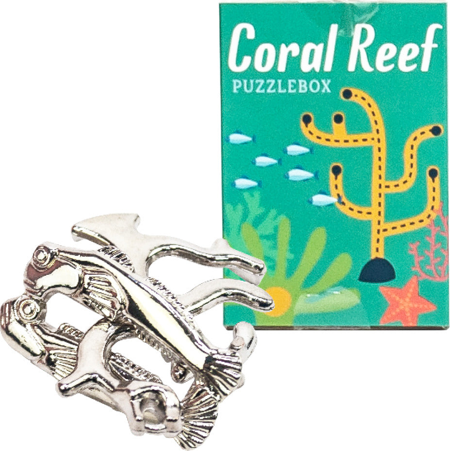 The Under the Sea Puzzle features a mechanical puzzle shaped like various fish intertwined, alongside a colorful packaging that reads 'Coral Reef PUZZLEBOX.' The design showcases aquatic themes with vibrant colors and illustrations of coral and fish.