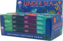 Display of the Under the Sea Puzzle by Project Genius, featuring various colorful puzzle boxes arranged in a block. The boxes indicate different difficulty levels: Easy, Medium, and Hard. Illustrations include vibrant sea creatures like jellyfish and sea turtles, surrounded by underwater plants and a large title label at the back.