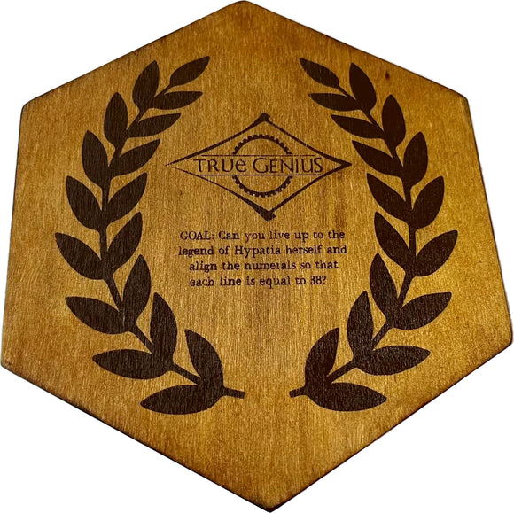 The Hypatian Enigma by True Genius, a mechanical puzzle featuring a hexagonal wooden base adorned with a laurel design. Inscribed are the words: 'GOAL: Can you live up to the legend of Hypatia herself and align the numerals so that each line is equal to 38?'