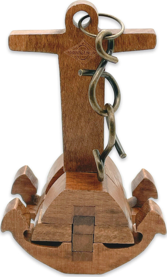 Close-up view of the Chain & Anchor mechanical puzzle by Project Genius. The puzzle is crafted from wood and features intricate designs including a cross, anchor, and chain. It challenges users to creatively figure out how to disassemble and reassemble the pieces.