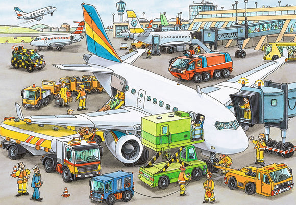 A colorful illustration of a busy airport scene featuring a large airplane being serviced. Ground vehicles such as fuel trucks, luggage carts, and maintenance vehicles surround the plane. Airport staff in safety gear are actively working on the tarmac, loading luggage, and preparing for aircraft departure. Various airplanes are visible in the background, with a control tower overseeing the bustling activity.