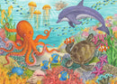 A colorful jigsaw puzzle featuring an undersea scene with a smiling octopus, a dolphin, a turtle, various fish, and vibrant coral. The artwork is detailed and bright, ideal for children.