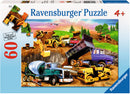 Ravensburger Construction Crowd 60-piece jigsaw puzzle featuring a vibrant scene with construction vehicles like trucks, a cement mixer, and heavy machinery working on a site surrounded by trees and a blue sky, designed for ages 4 and up.