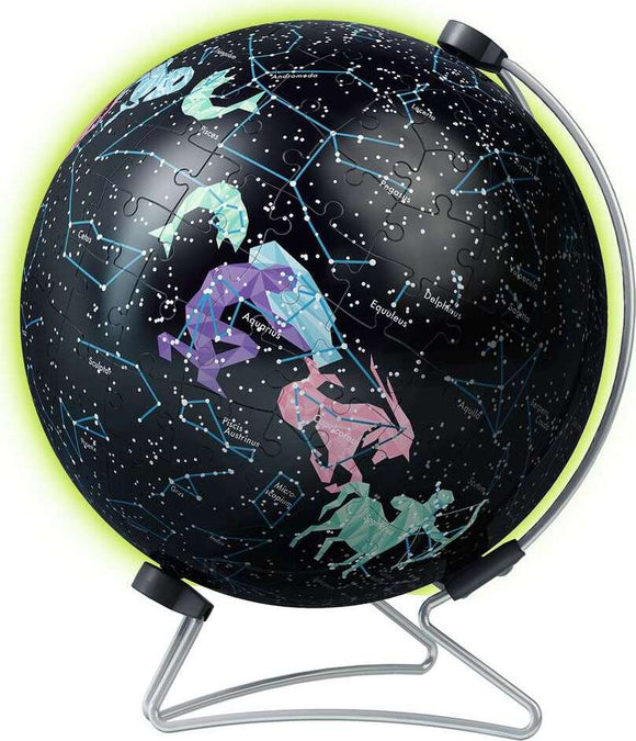 A 180-piece jigsaw puzzle of a glow-in-the-dark star globe by Ravensburger. The globe features colorful illustrations of constellations against a starry black background, with a wire stand that holds it upright. Ideal for astronomy enthusiasts and puzzle lovers, it lights up in the dark to showcase the stars.