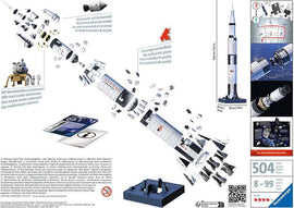 Apollo Saturn V Rocket 3D puzzle by Ravensburger. The image displays an exploded view of the intricate pieces, showcasing the rocket's components, including the command module, service module, and lunar module, ideal for ages 8 and up. The puzzle consists of 504 high-quality plastic pieces and features images of astronauts and the rocket's mission details.