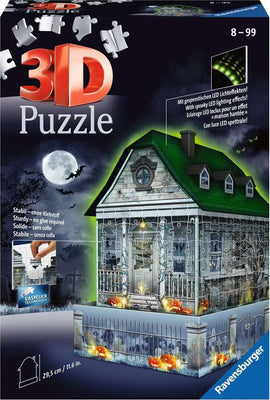 The 3D Haunted House Night Edition jigsaw puzzle by Ravensburger features a spooky house illuminated by LED lights. The puzzle includes detailed artwork with Halloween-themed decorations like pumpkins, bats, and an eerie background, showcasing a haunted setting. It is designed to be sturdy without the need for glue, measuring 29.5 cm in height, perfect for ages 8 and up.