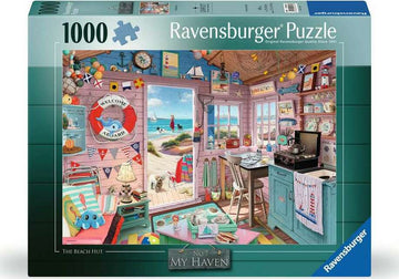 The Beach Hut 1000 pc Jigsaw Puzzle by Ravensburger. The box showcases a charming interior of a beach hut, featuring nautical decor, colorful beach-themed items, and a picturesque view through the open window of a sandy beach with sailboats. Perfect for family fun and puzzle lovers.