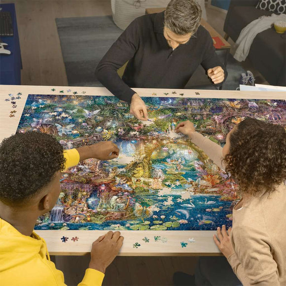 A group of three adults engaged in assembling a vibrant jigsaw puzzle titled 'The Hidden World of Fairies' by Ravensburger. The puzzle features enchanting fairy scenes with vivid colors, surrounded by pieces scattered on the table. The setting appears cozy, with a hint of modern decor in the background.