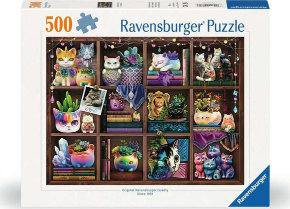 Ravensburger jigsaw puzzle titled 'Cubby Cats and Succulents 500', featuring colorful illustrations of cats and succulents arranged on wooden shelves. The lively scene includes whimsical cat figurines, various pot plants, and decorative elements, creating a charming and vibrant look perfect for puzzle enthusiasts.