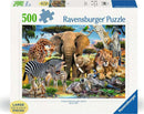 A colorful 500-piece jigsaw puzzle by Ravensburger titled 'Baby Love.' The puzzle features a vibrant wildlife scene filled with various animals, including a giraffe, elephant, zebra, lions, monkeys, and tropical birds in a natural setting. The packaging highlights the large, easy-to-handle puzzle pieces. Perfect for family fun and animal lovers.