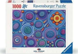 Ravensburger jigsaw puzzle titled 'Celestial Constellations'. The illustration features a vibrant cosmic design with various colorful planets, stars, and celestial shapes, set against a deep purple and blue background. This 1000-piece puzzle is perfect for astronomy lovers and puzzle enthusiasts alike.