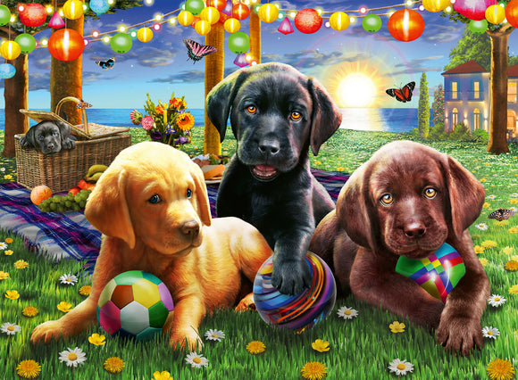 A colorful jigsaw puzzle featuring three adorable puppies in a vibrant picnic setting. The scene includes a black puppy with a brown puppy and a yellow puppy, playing with colorful balls on a lush green lawn surrounded by flowers. A picnic basket filled with fresh fruits and a scenic seaside backdrop adds to the charm, with festive lights and butterflies fluttering around.