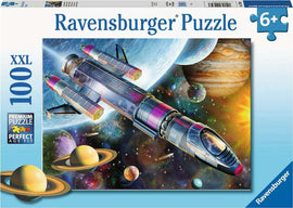 Ravensburger 'Mission in Space' 100-piece jigsaw puzzle featuring a vivid illustration of a spacecraft traveling through space, surrounded by planets, stars, and a colorful cosmic backdrop. Suitable for ages 6 and up.