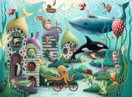 Colorful jigsaw puzzle featuring an underwater scene filled with whimsical sea creatures and charming underwater houses. The picture includes a large whale, an octopus riding a bicycle, playful fish, and a cheerful turtle, all set against a vibrant ocean backdrop. Ideal for family fun and relaxation.