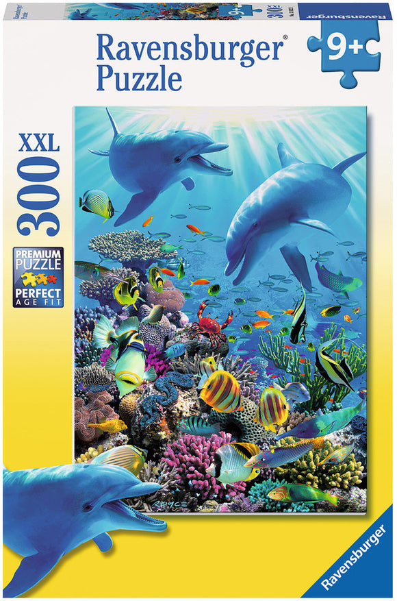 The Ravensburger Underwater Adventure jigsaw puzzle features a vibrant underwater scene with dolphins, colorful fish, and coral reefs. This 300-piece puzzle is designed for ages 9 and up, showcasing detailed marine life in a bright, engaging illustration. The box highlights the premium quality and XXL size of the puzzle pieces, making assembly enjoyable for puzzle enthusiasts.