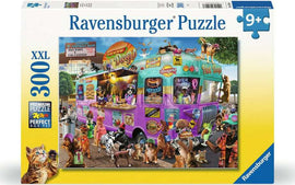 The Ravensburger Hot Diggity Dogs 300-piece jigsaw puzzle features a colorful and whimsical scene of a hot dog stand adorned with playful cats and dogs. The vibrant food truck is decorated with various catchy signs, while several animals, including a dog and multiple cats, engage in fun activities around it. Perfect for puzzle lovers of all ages.