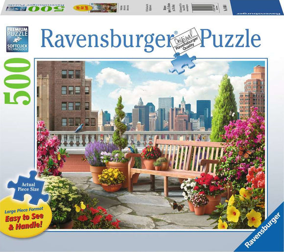 A colorful 500-piece jigsaw puzzle by Ravensburger showcasing a beautiful rooftop garden filled with vibrant flowers, plants, and a scenic city skyline in the background. The image features a wooden bench surrounded by potted plants and butterflies, capturing a serene outdoor space.