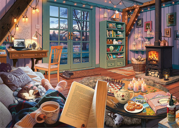 A cozy indoor scene featuring a jigsaw puzzle set in a warmly decorated room. The image showcases a comfortable chair with a blanket and a sleeping cat, a wooden desk with a laptop, and a table filled with tea, cookies, and an open book. Soft lighting and a fireplace add to the inviting atmosphere, enhanced by large windows overlooking a tranquil landscape.