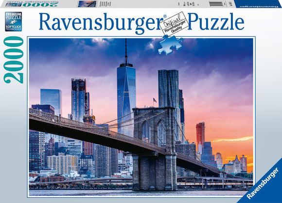 Ravensburger Skyline New York jigsaw puzzle featuring a stunning sunset view of New York City, including the Brooklyn Bridge and iconic skyscrapers, showcasing 2000 high-quality pieces for an engaging puzzle experience.