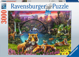 A vibrant jigsaw puzzle box featuring a lush, colorful scene of tigers in a tropical paradise. The illustration showcases multiple tigers amidst a serene landscape with waterfalls, flora, and other wildlife, highlighting the detail and beauty of nature. The box indicates it is a 3000-piece Ravensburger puzzle.