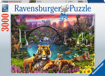 A vibrant jigsaw puzzle box featuring a lush, colorful scene of tigers in a tropical paradise. The illustration showcases multiple tigers amidst a serene landscape with waterfalls, flora, and other wildlife, highlighting the detail and beauty of nature. The box indicates it is a 3000-piece Ravensburger puzzle.