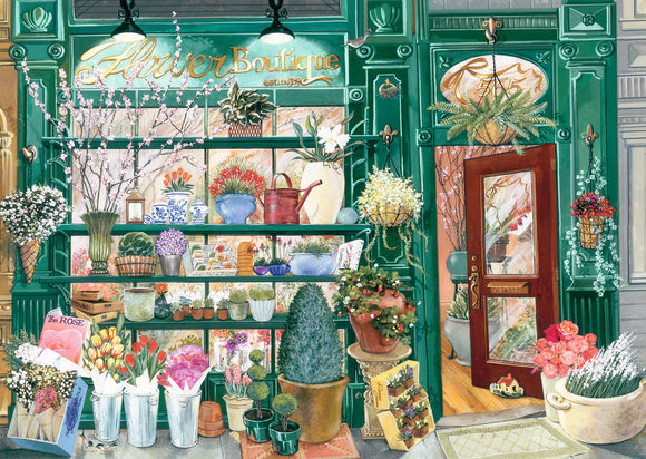A vibrant 300-piece jigsaw puzzle featuring a flower shop scene. The image displays colorful flowers in vases and pots, a green storefront, and a welcoming door. Perfect for puzzle lovers and floral enthusiasts.
