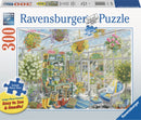 Greenhouse Heaven 300-piece jigsaw puzzle by Ravensburger featuring a vibrant and cozy greenhouse scene filled with flowers, gardening tools, and a cat resting on a chair. The vivid colors and details create a charming visual for puzzle enthusiasts.