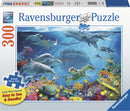 Ravensburger jigsaw puzzle titled 'Life Underwater' featuring a vibrant underwater scene with various sea creatures including dolphins, turtles, and colorful fish against a coral background. This 300-piece large format puzzle is designed for easy assembly, promoting a fun and engaging experience.