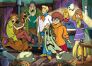 Scooby Doo Unmasking 1000 piece jigsaw puzzle featuring famous characters from the series including Scooby Doo, Shaggy, Velma, Daphne, and Fred. The group is inside a spooky setting with a ghost and lanterns, creating an adventurous scene.
