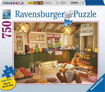A 750-piece jigsaw puzzle featuring a cozy kitchen scene. The image depicts a warm and inviting kitchen with colorful utensils and baked goods. A dog sits contentedly by the oven, while a person enjoys a cup of coffee amidst the delightful cookies and pastries on the table, creating a heartwarming atmosphere for puzzle enthusiasts.