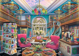 A vibrant illustration of The Book Palace jigsaw puzzle by Ravensburger, showcasing a colorful library with pink chairs, wooden bookshelves, and a spiral staircase. A table with open books and a cat, surrounded by flowers and vibrant decor, offers a cozy reading atmosphere.