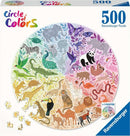 A Ravensburger 500-piece round jigsaw puzzle titled 'Circle of Colors', featuring a vibrant array of illustrated animals arranged in a circular design. The puzzle depicts diverse animals like elephants, pandas, and birds amid colorful foliage, enhancing the visual appeal with a rainbow gradient background. The packaging includes an image of the completed puzzle and a poster for reference.