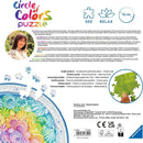 A vibrant jigsaw puzzle featuring a beautifully designed rainbow cake adorned with colorful swirls and intricate details. The puzzle, made by Ravensburger, consists of 500 pieces and measures 52 cm in diameter. Ideal for puzzle enthusiasts, this piece invites creativity and fun in assembling a delightful treat decorated with hues of pink, blue, yellow, and green, showcasing the artistic talent of Ukrainian artist Inna Markova.