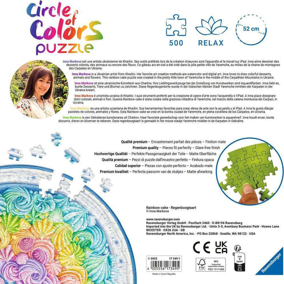 A vibrant jigsaw puzzle featuring a beautifully designed rainbow cake adorned with colorful swirls and intricate details. The puzzle, made by Ravensburger, consists of 500 pieces and measures 52 cm in diameter. Ideal for puzzle enthusiasts, this piece invites creativity and fun in assembling a delightful treat decorated with hues of pink, blue, yellow, and green, showcasing the artistic talent of Ukrainian artist Inna Markova.