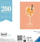 A 200-piece jigsaw puzzle titled 'Puzzle Moments: Drinks' by Ravensburger, featuring a colorful illustration of a spritz cocktail in a glass with orange slices, designed to provide relaxation and enjoyable 'me time'. The box design showcases a light pink background with the word 'SPRITZ' prominently displayed at the bottom.