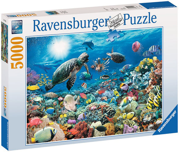 Ravensburger Beneath the Sea 5000 piece jigsaw puzzle box featuring a vibrant underwater scene teeming with colorful fish, coral, and sea turtles, showcasing premium quality and soft click technology for seamless assembly.