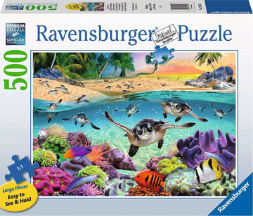 Ravensburger Race of the Baby Sea Turtles jigsaw puzzle featuring a vibrant underwater scene with baby sea turtles swimming among colorful coral and fish. The puzzle box displays a beach and tropical landscape in the background, indicating a 500-piece set designed for easy handling with large pieces.