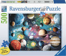 Ravensburger Planetarium 500 pc jigsaw puzzle showcasing a vibrant cosmic scene with planets and stars on a colorful background. Features soft-click technology for precise fitting of pieces. The box highlights large and easy-to-hold pieces designed for enjoyable puzzling.