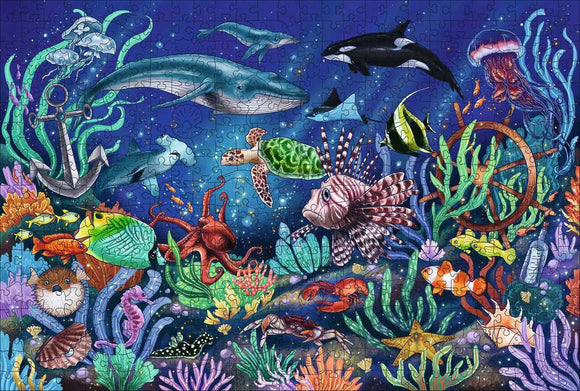 A vibrant 500-piece Ravensburger jigsaw puzzle titled 'WOOD: Under the Sea'. The artwork features a colorful underwater scene filled with various sea creatures including a whale, dolphin, turtle, fish, octopus, and jellyfish, surrounded by lush corals and an anchor.