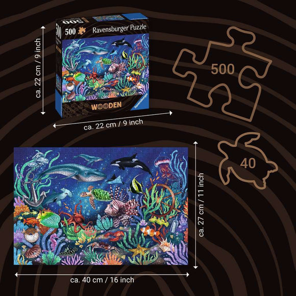 A 500-piece jigsaw puzzle titled 'WOOD: Under the Sea' by Ravensburger. The box features a vibrant underwater scene filled with colorful fish, coral reefs, and marine life, showcasing a variety of species such as dolphins, jellyfish, and sea turtles. The puzzle measures approximately 40 cm by 27 cm when completed, while the box dimensions are 22 cm by 22 cm.