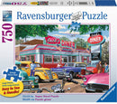 Ravensburger jigsaw puzzle titled 'Meet you at Jack's' featuring a colorful diner scene with classic cars and people in 1950s attire, designed with large pieces for easy handling. The box displays the puzzle dimensions of 32x24 inches, suitable for puzzle enthusiasts looking for a nostalgic and enjoyable experience.